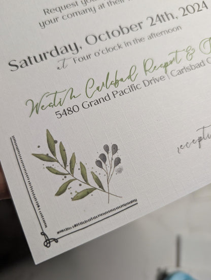 Invitation card with greenery design and text on a white background