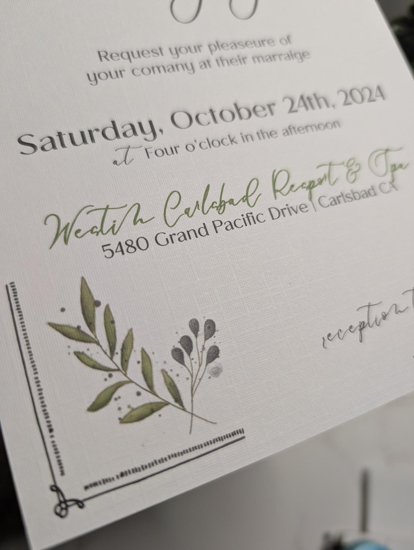 Wedding invitation card with greenery design and text