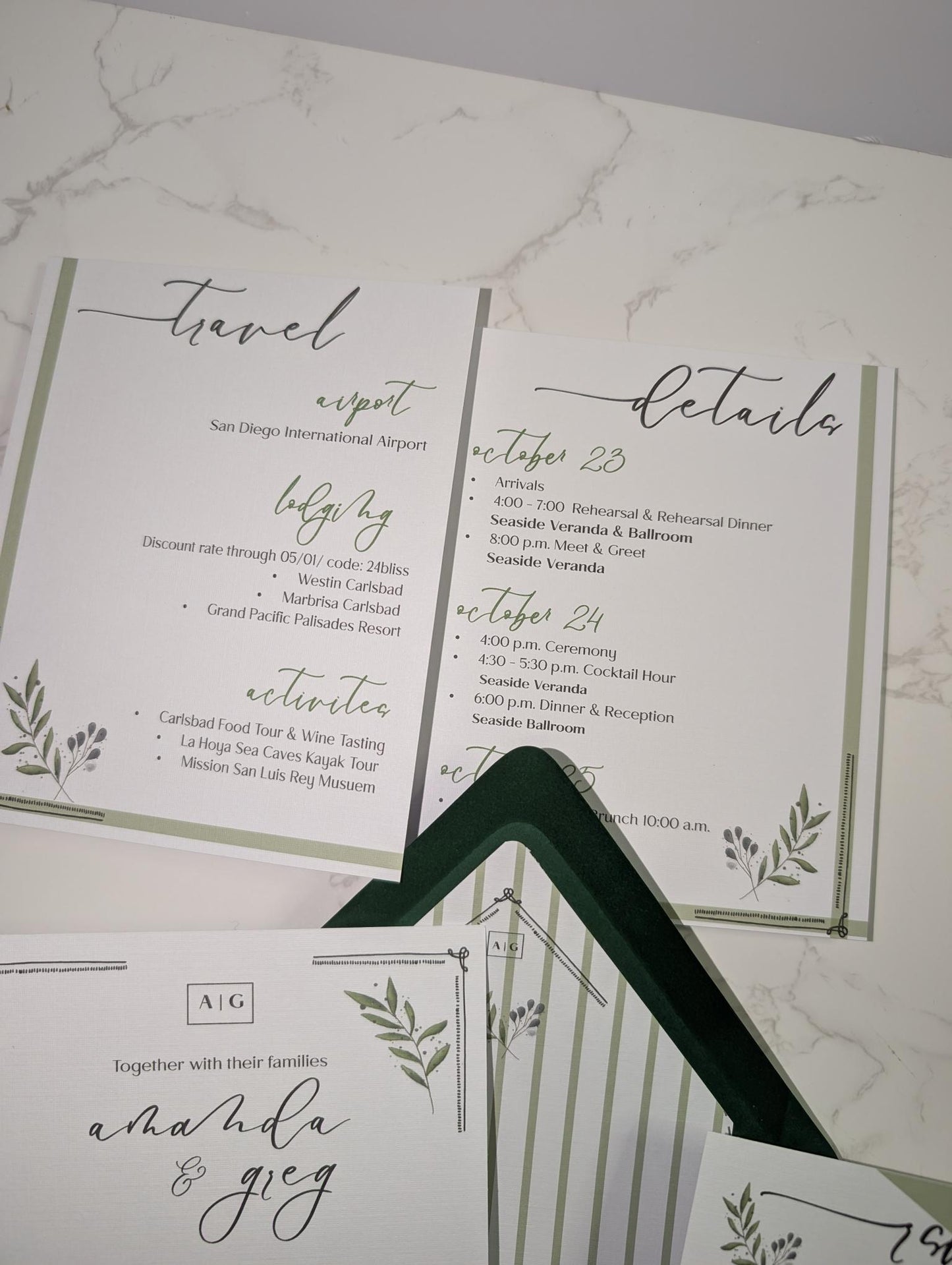 Wedding invitation with greenery design on a marble surface