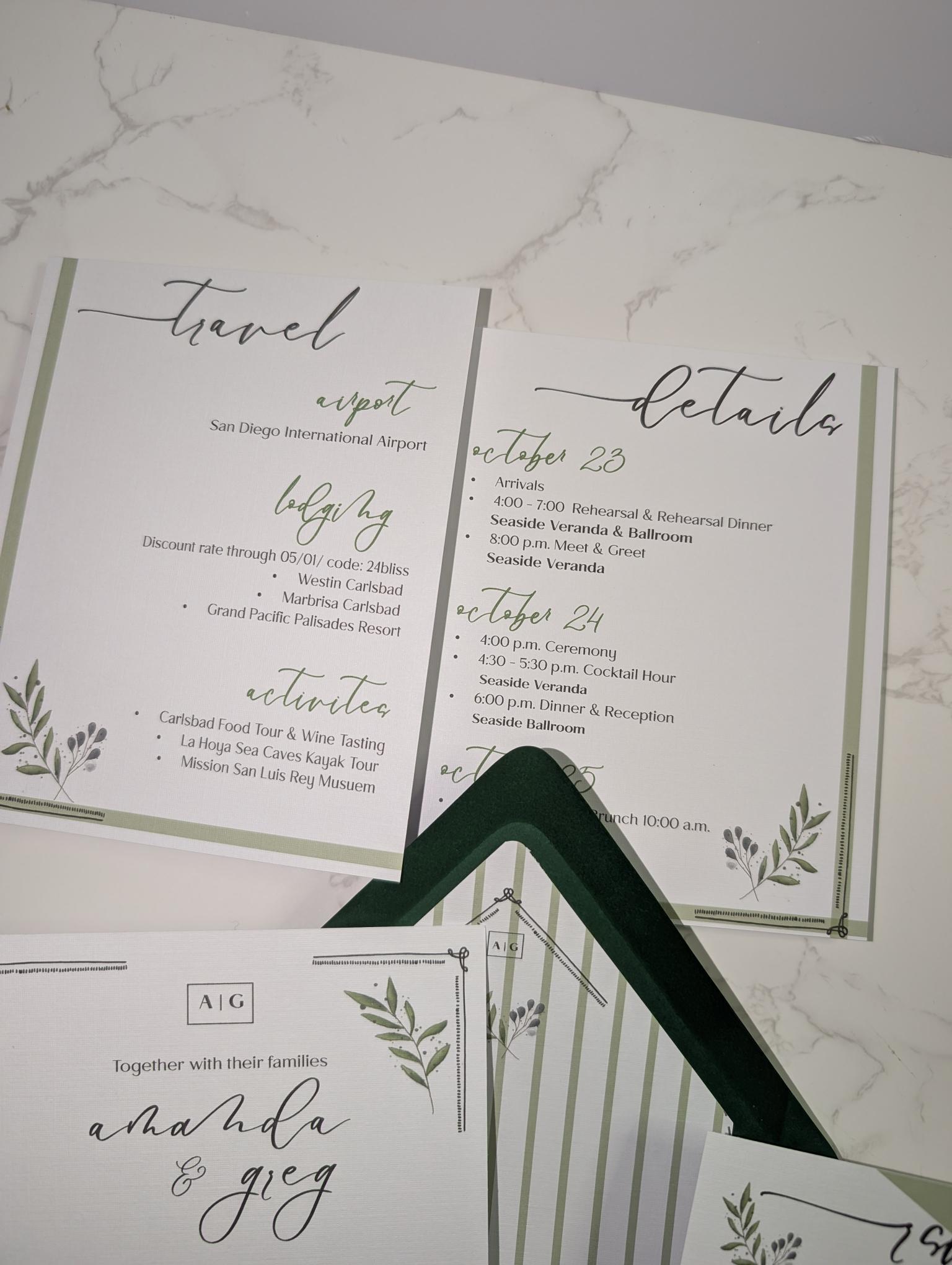 Wedding invitation with greenery design on a marble surface