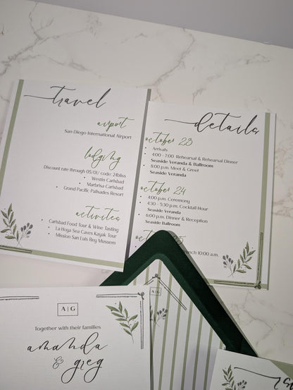 Wedding invitation with greenery design on a marble surface