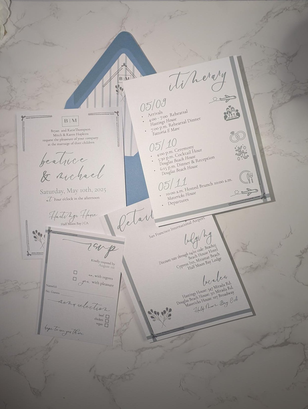 Set of wedding invitations on a marble surface
