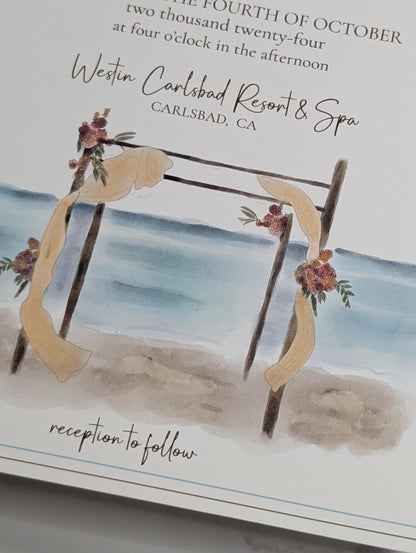 Invitation card with beach scene and floral arch design, featuring Westin Carlsbad Resort & Spa.