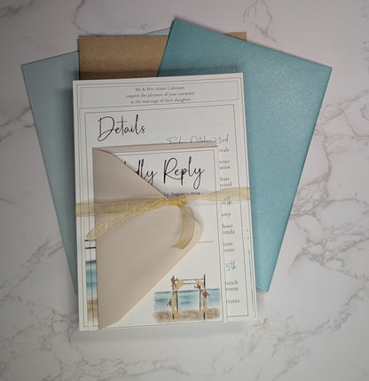 Wedding invitation card with RSVP details on a marble surface