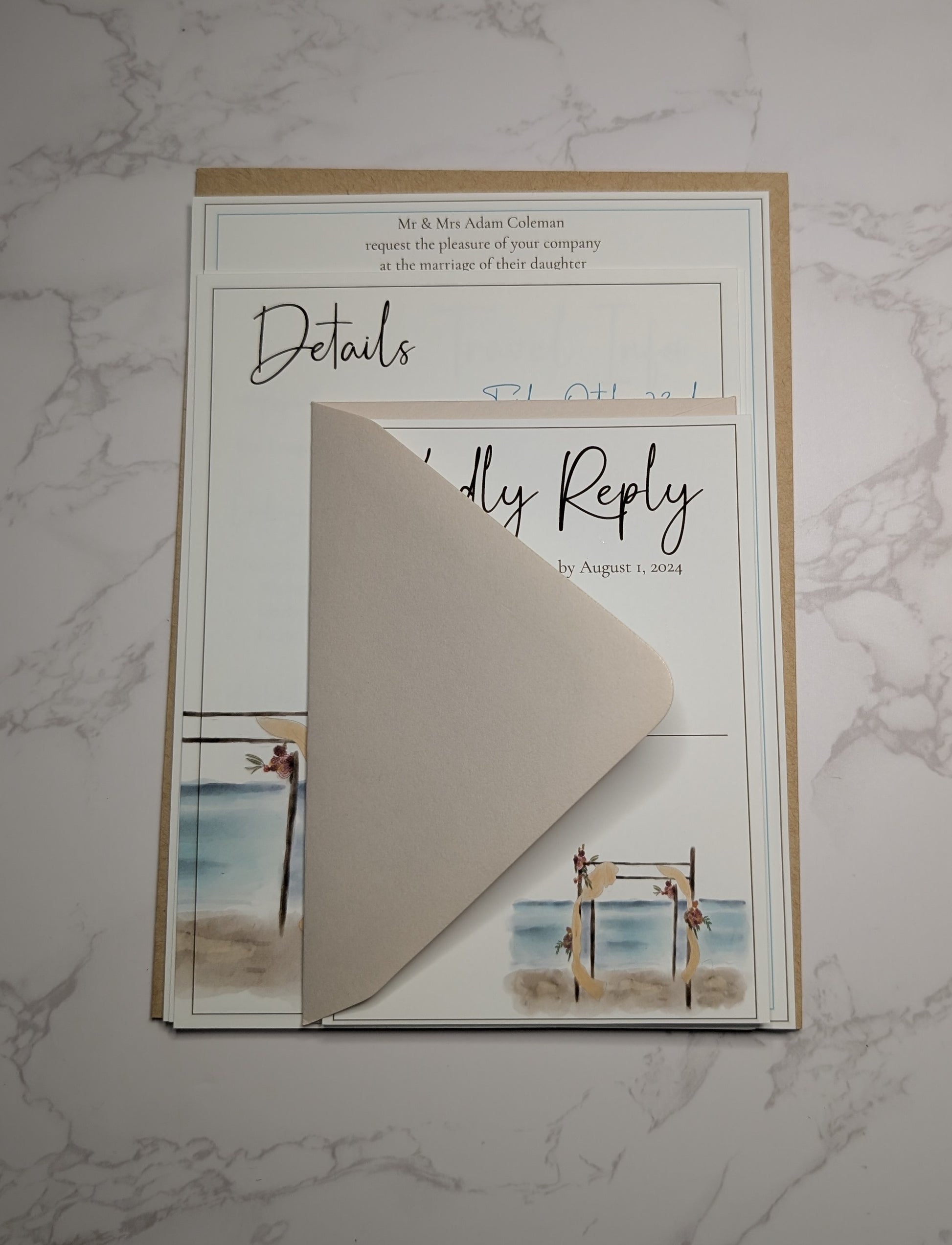 Wedding invitation with envelope on a marble surface