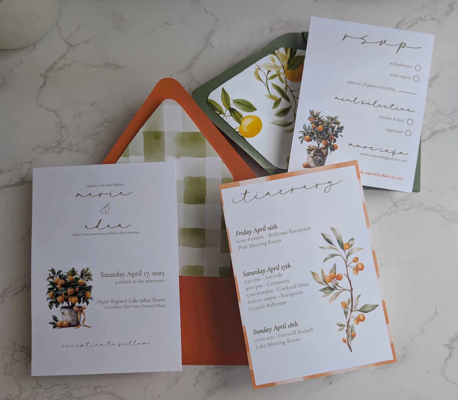Set of wedding invitations with floral designs on a marble surface