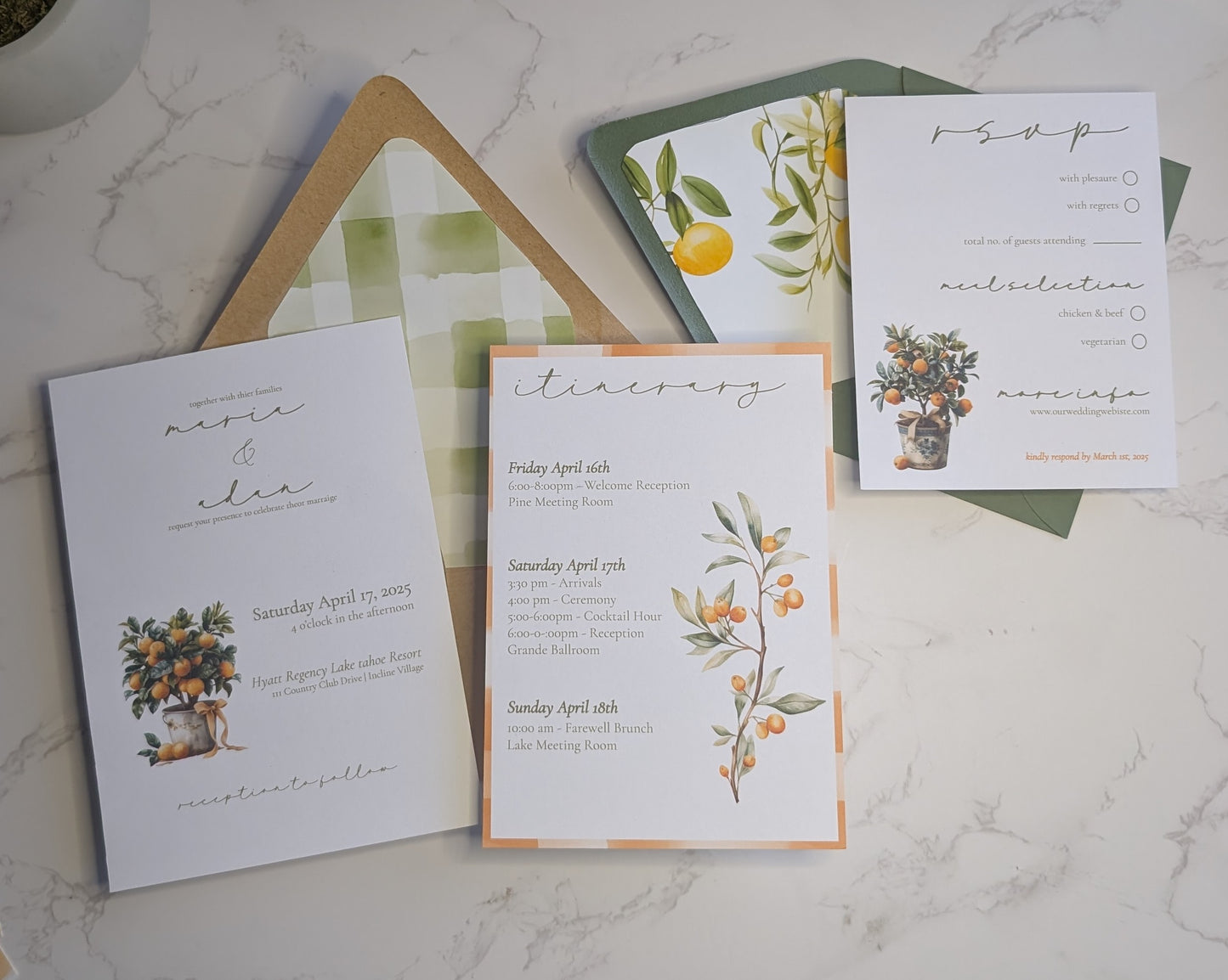 Set of wedding invitations with floral designs on a marble surface