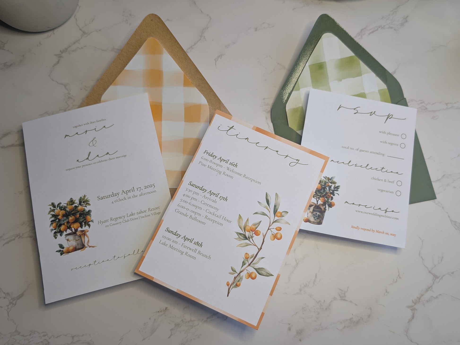 Wedding invitation set with floral designs on a marble surface