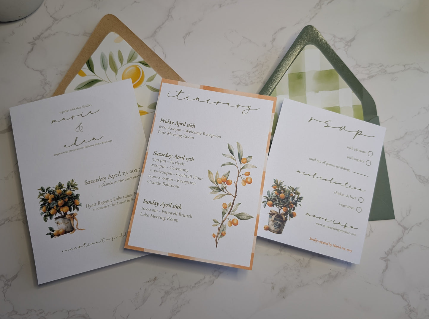 Wedding invitation set with floral designs on a marble surface