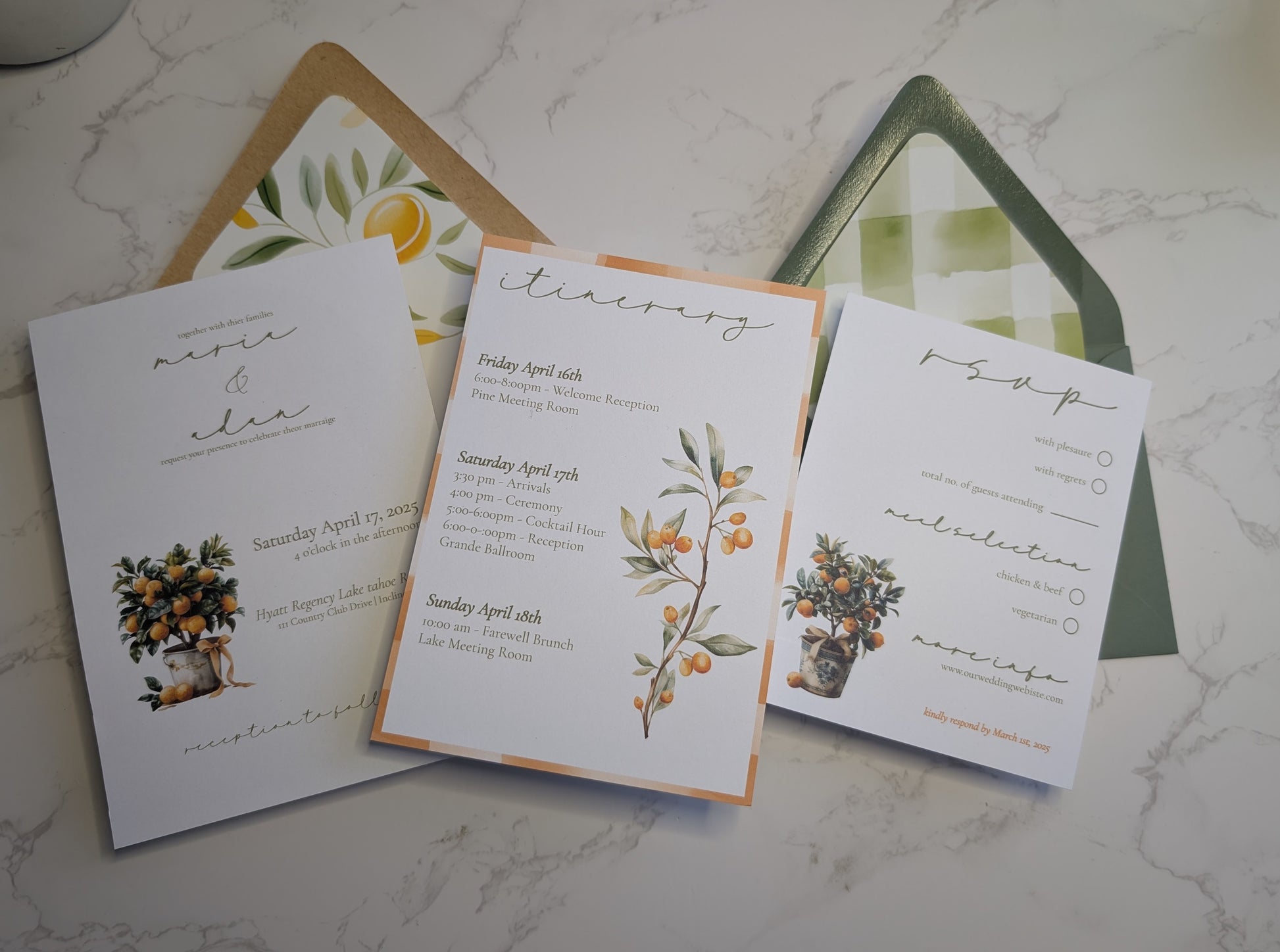 Wedding invitation set with floral designs on a marble surface