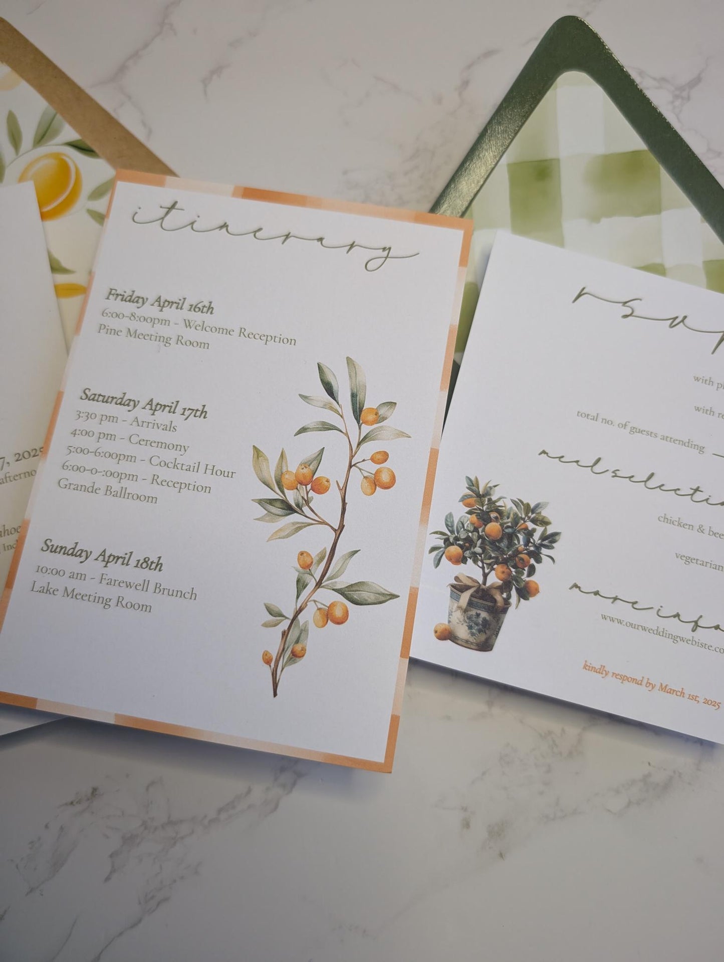 Wedding invitation set with itinerary and RSVP card on a marble surface