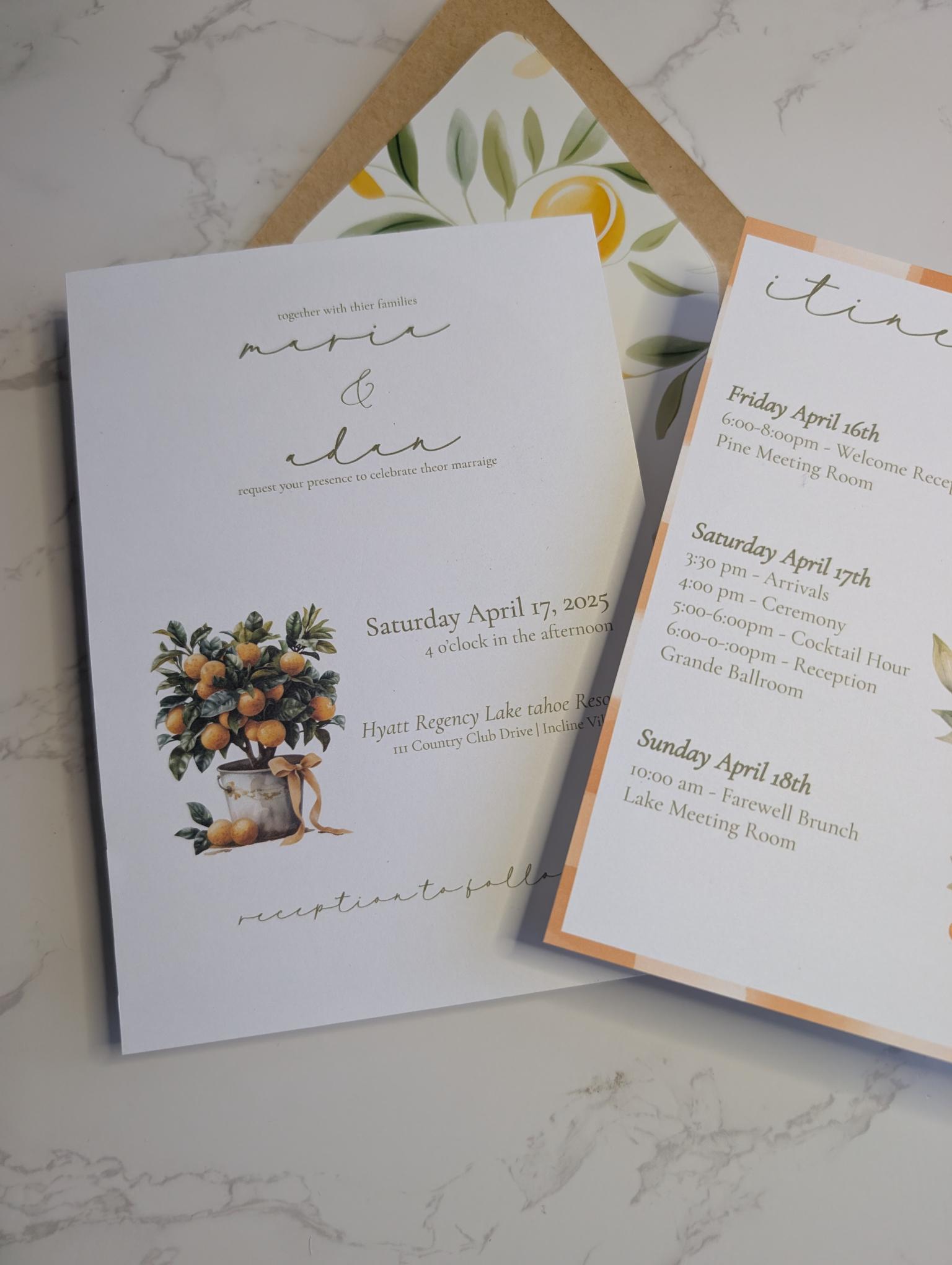 Wedding invitation card with floral design and text on a marble surface