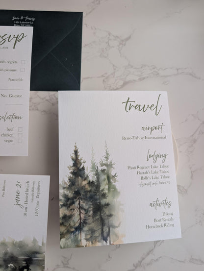 Wedding invitation suite with trees and text on a marble surface