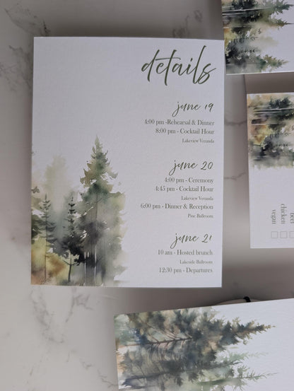 Invitation card with watercolor trees and event details on a marble surface