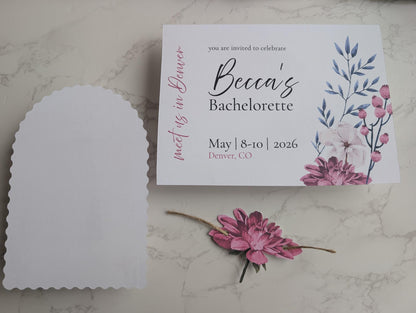 Bachelorette party invitation with floral design on a marble surface