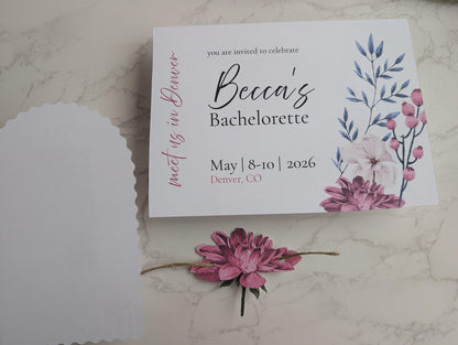 Bachelorette party invitation with floral design on a marble surface