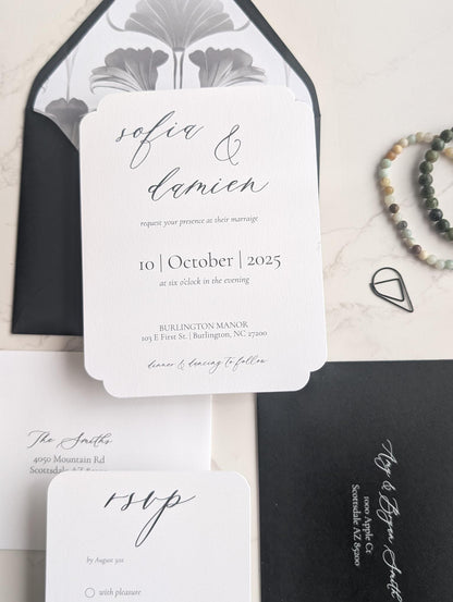 Wedding invitation set with black and white design on a light background
