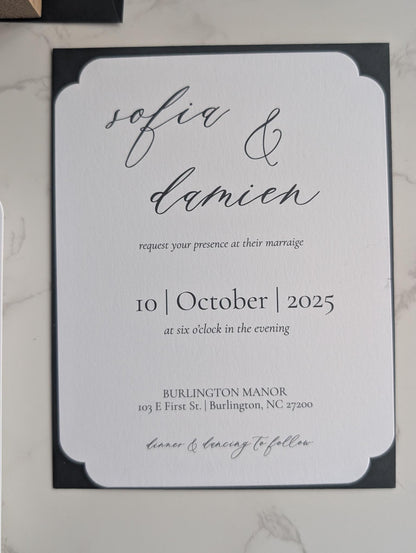 Wedding invitation card with 'sofia & damien' and event details on a marble surface.