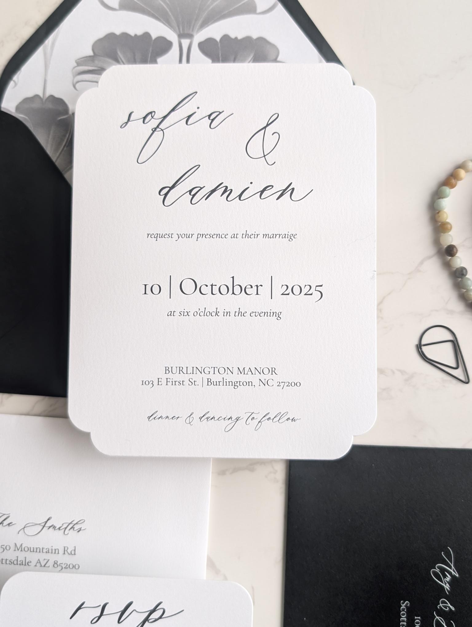 Wedding invitation card with black text on a white background
