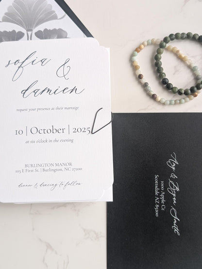 Wedding invitation card with RSVP card on a marble surface