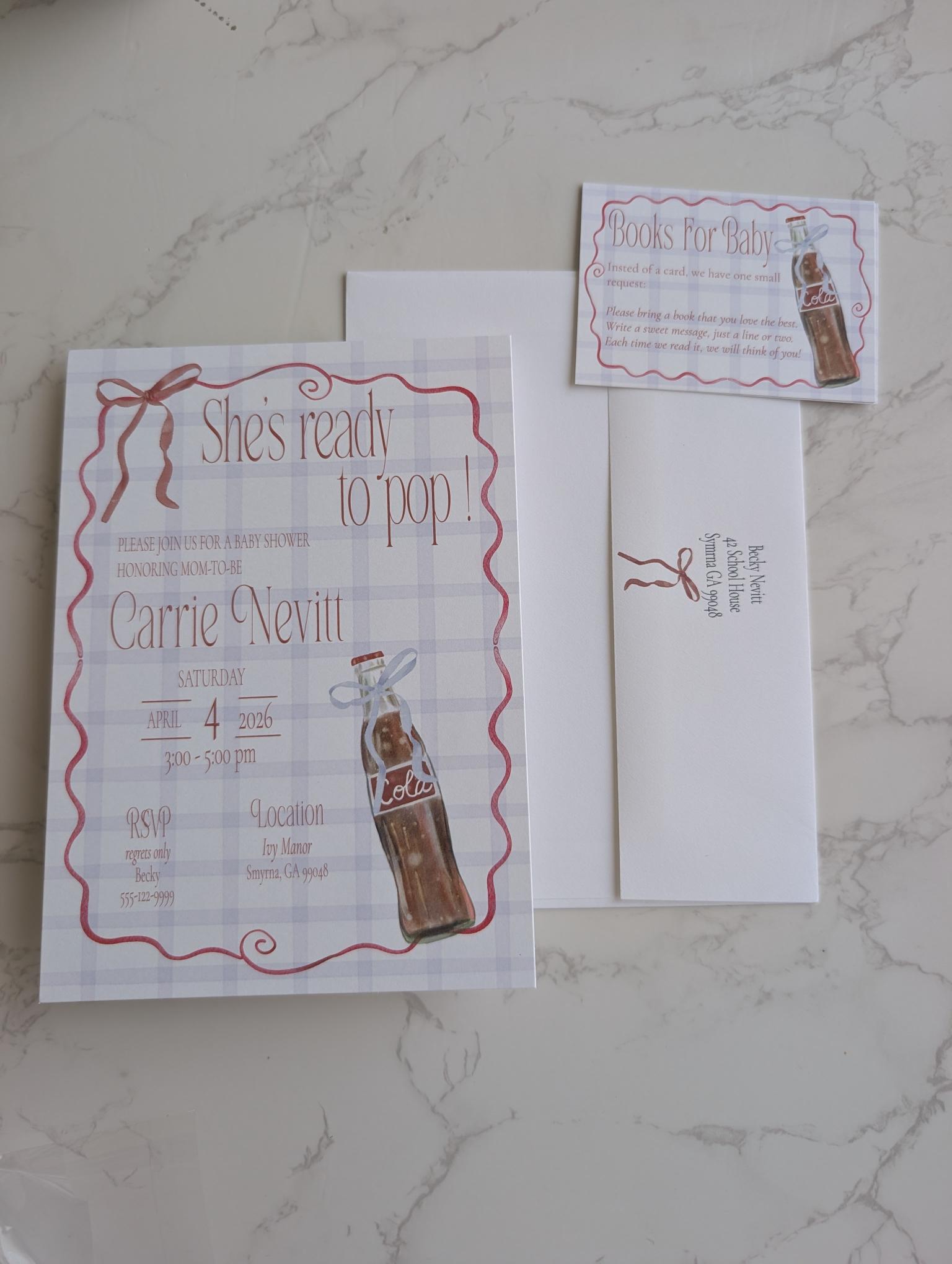 A flat-lay of a personalized birthday invitation suite featuring a main invitation card, an RSVP card, and an envelope on a light gray marble background. The design has a white and light gray plaid pattern with a red wavy border, brown ribbon graphic, and an illustration of a vintage Coca-Cola bottle.