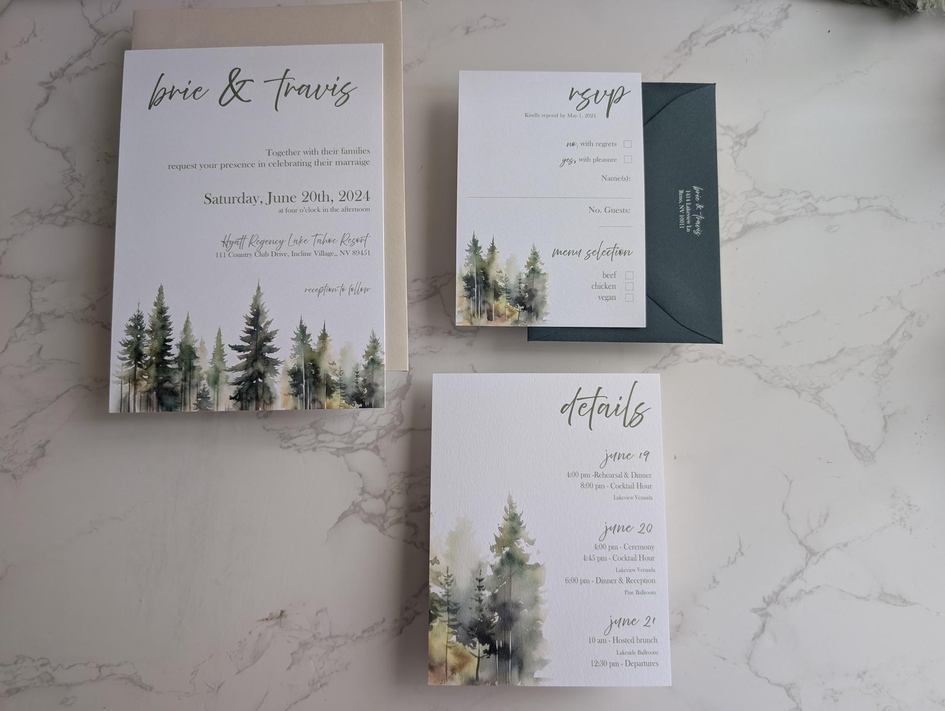 Wedding invitation set with trees on a marble surface