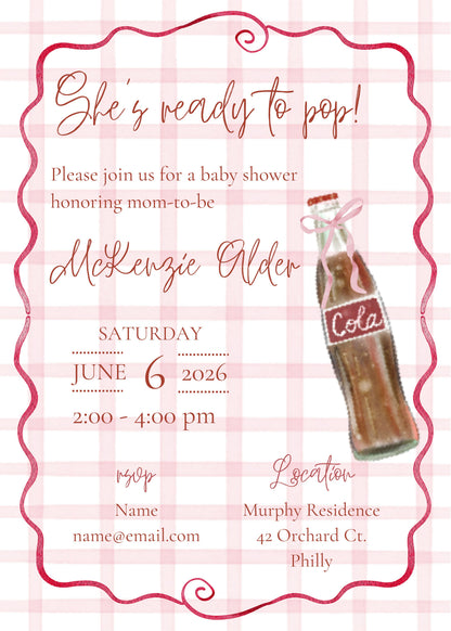 A baby shower invitation card with a pink and white gingham background, featuring a pink decorative border, cursive text reading 'She's ready to pop!' and event details, plus an illustration of a vintage Coca-Cola bottle.