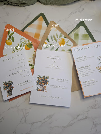Set of wedding invitations with different color options on a marble surface.