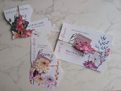 Invitation cards with floral designs on a marble surface
