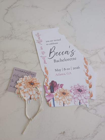 Bachelorette party invitation with floral design on a marble surface