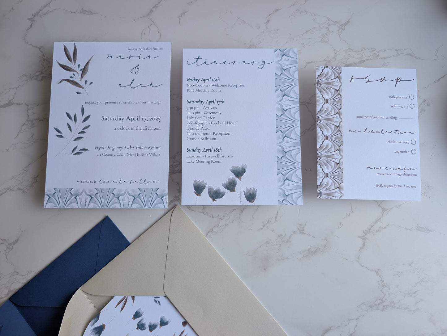 Wedding invitation set with RSVP card on a marble surface