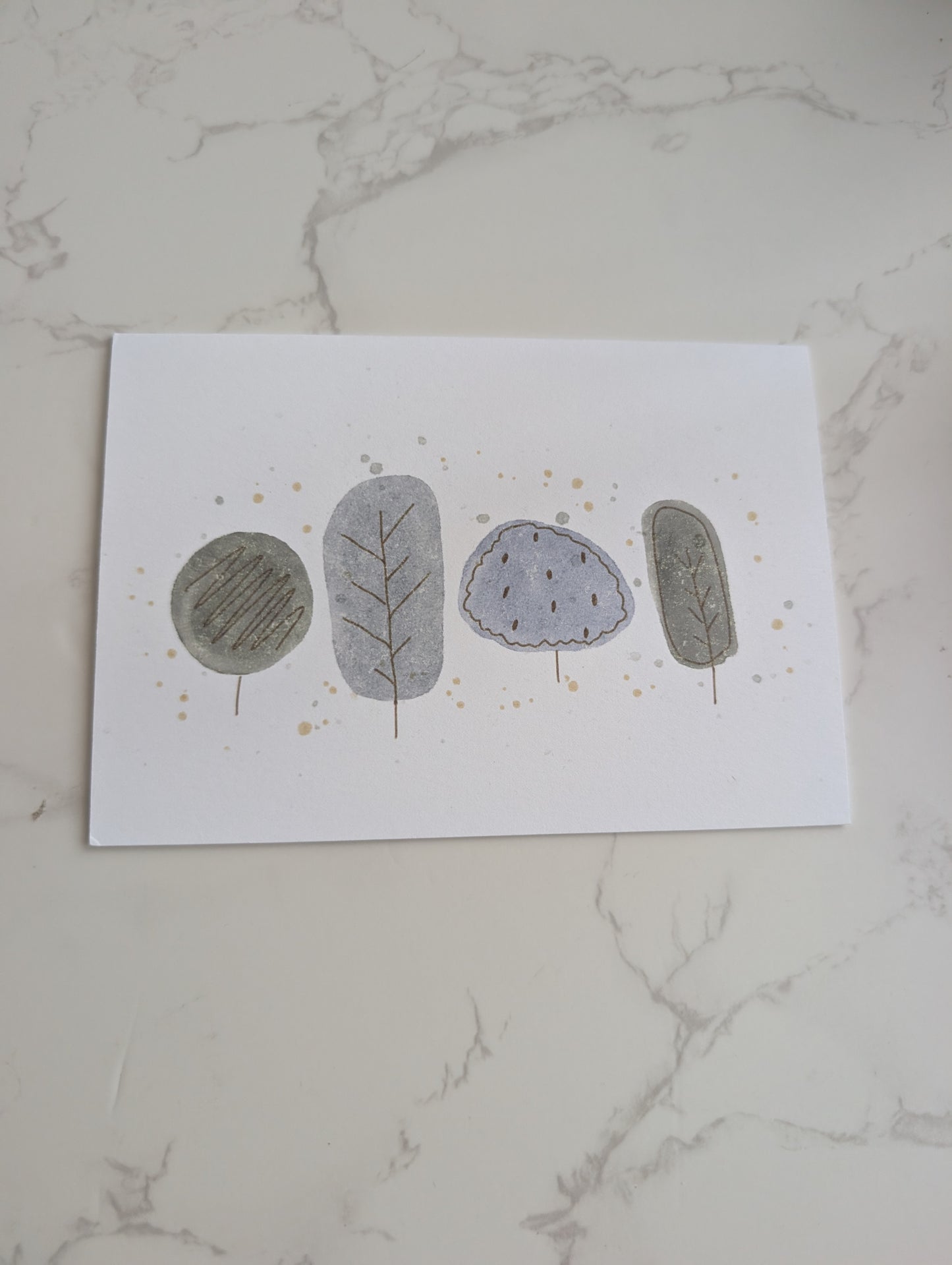 Four stylized stones with different textures on a white marble surface