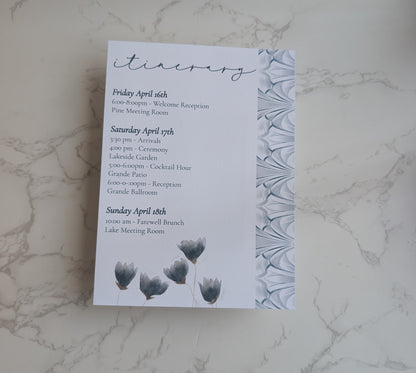 Invitation card with event details on a marble surface