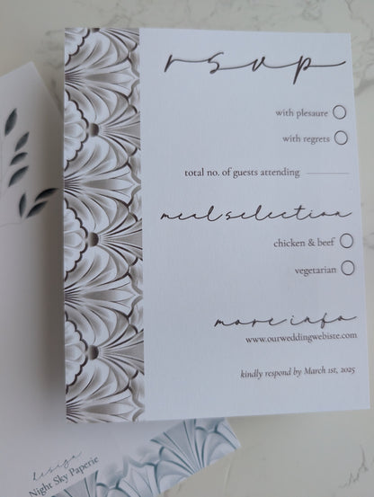 White RSVP card with floral pattern on the left side
