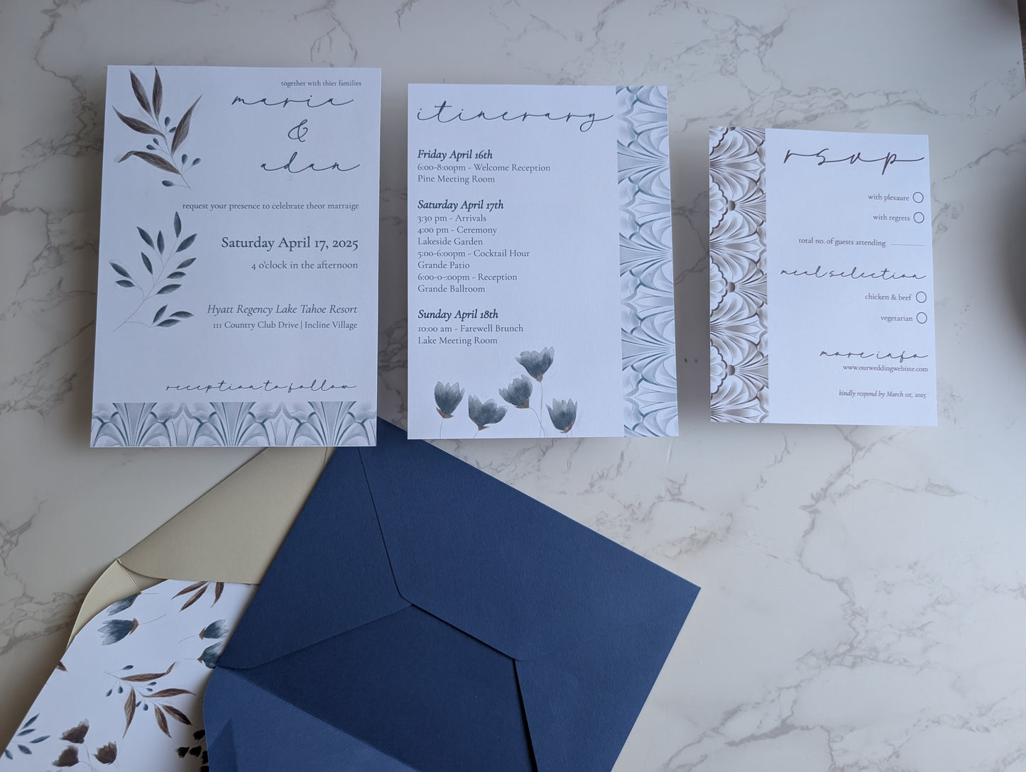 Wedding invitation set with RSVP card, envelope, and details on a marble surface